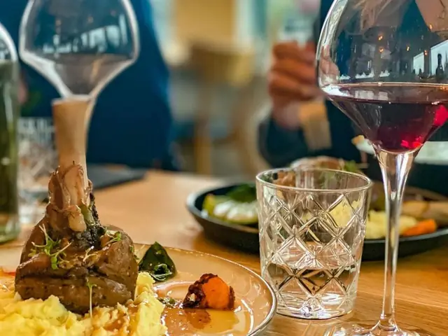 Dish and glass of wine at the Landbrot Guesthouse restaurant